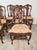 A set of ten Italian fruitwood provincial dining chairs, circa 1920. Eight side chairs, two armchairs. The side chairs...