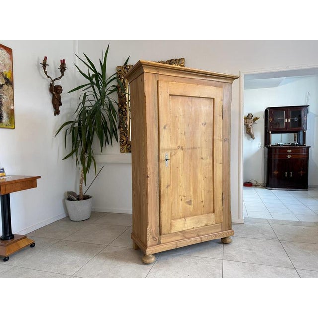 Restored antique farmhouse cupboard, natural wood, from the Biedermeier period. Dimensions: Height x Width x Depth 178 x...