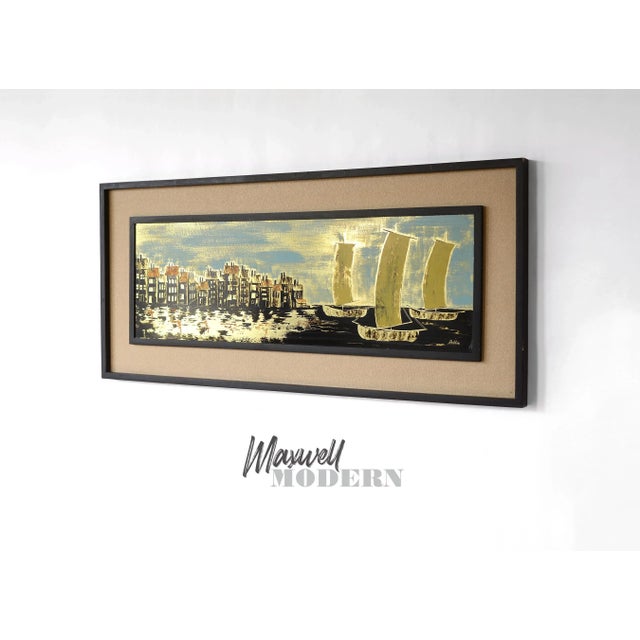 Beautiful and unique piece from the 1960s! This painting of a picturesque waterfront village with sailboats is done on a...