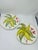This is a pair of hand-painted Italian ceramic plates by La Ceramica, each capturing a lively, painterly expression of...