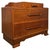 A handsome vintage 20th-century English low chest of drawers, finely crafted from oak and distinguished by its compact...