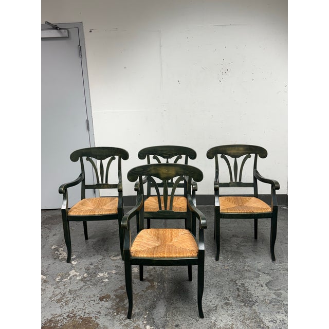 Design Plus Gallery presents a Set of Four Napoleon Dining Chairs from Pottery Barn. These armchairs blend traditional...