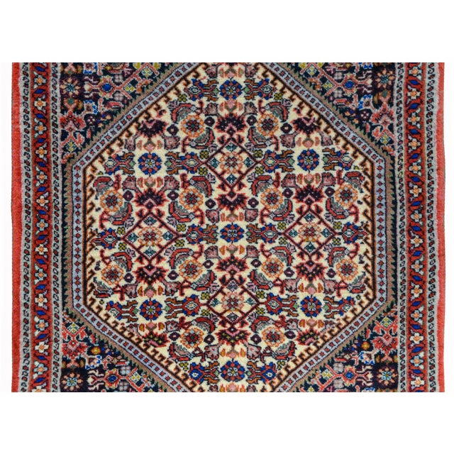 A wonderful vintage Persian Bidjar rug with a diamond medallion with a stylized floral pattern amidst a field of more...