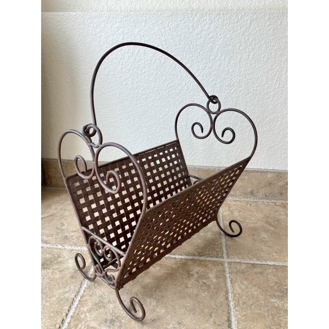 Excellent Pre-Owned Condition. This fabulous rustic industrial-look wrought iron magazine/media stand will keep your...