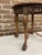 Decorative French Louis XV style accent table complete with glass top. Woven can top and intricately carved apron with...