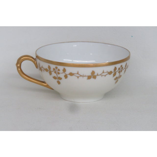 This stunning Gilt Teacup is made of porcelain. This cup presents a beautiful white porcelain base with a gold gilt rim...