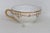 This stunning Gilt Teacup is made of porcelain. This cup presents a beautiful white porcelain base with a gold gilt rim...
