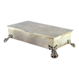 Silver Jewelry Box with Floral Motifs Engraved on the Lid and Resting on Four Claw-Shaped Feet For Sale