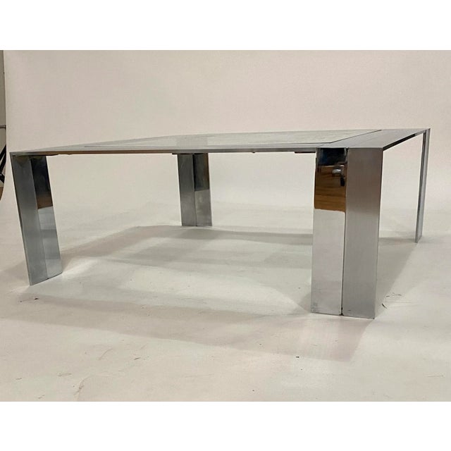 Mid-century modern steel and glass cocktail table by Elaine Cohen for DIA (Design Institute of America crafted from solid...