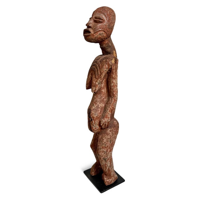 Striking Bena Lulua (Luluwa) female figure from the Democratic Republic of the Congo, this exceptional carved-wood...
