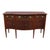 An antique English sideboard crafted in the Hepplewhite style, dating to approximately 1920. This piece is constructed...