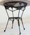 French iron table with a (replacement) Breccia marble top embodies a timeless combination of elegance and durability. The...