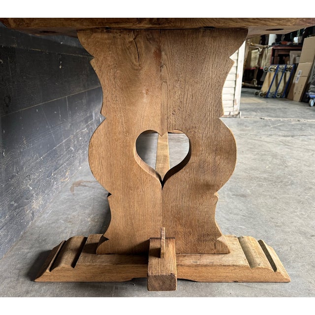 A lovely Solid Oak Farmhouse Dining Table, having trestle supports with hearts which is a lovely feature. Dating to the...