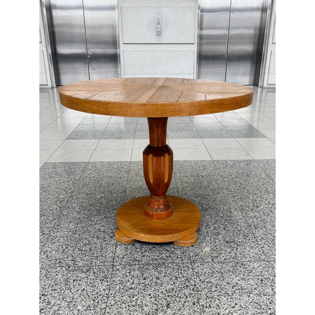 This Art Deco walnut round table was hand-crafted in the 1930s in Sweden. Harking back to Biedermeier design, the table...