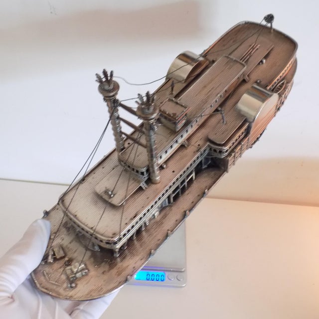 This vintage silver decorative object depicts a large and detailed model of the famous 1860 robert e. Lee steamboat,...