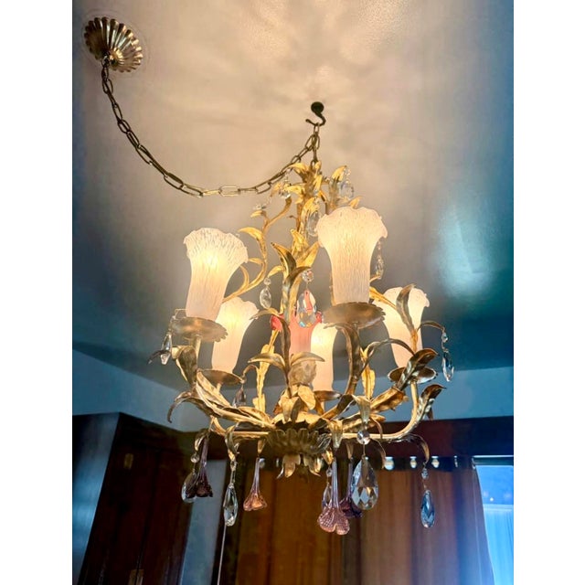 Glamorous mid century Italian Hollywood Regency chandelier with stunning details in gilt metal with sparkling crystal...