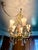 Glamorous mid century Italian Hollywood Regency chandelier with stunning details in gilt metal with sparkling crystal...