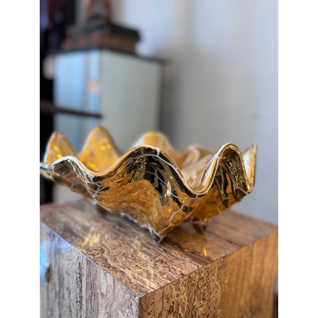 Absolutely stunning oversized ashtray here with a crackled gold glaze and clam design. Never seen one like it! Would be a...