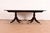 A gorgeous Regency or Georgian style double pedestal extension dining table By Smith & Watson USA, Circa Mid-20th Century...