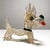 Hand-blown murano glass dog sculpture produced in italy during the 1960s. executed in clear glass with a subtle golden...