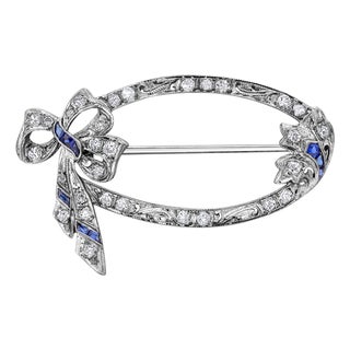 1940s Art Deco Sapphire Diamond Platinum Hand Engraved Millgrain Bow 1.30 Inch Brooch For Sale