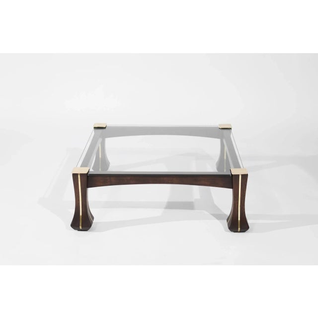 A fully restored vintage coffee table from 1970s Italy, designed by Luciano Frigerio. This elegant piece features...
