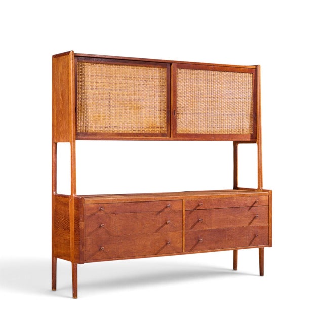 Hans Wegner for Ry Møbler RY-20 Mid Century Danish Teak and Rattan Highboard Credenza with Hutch This credenza with hutch...
