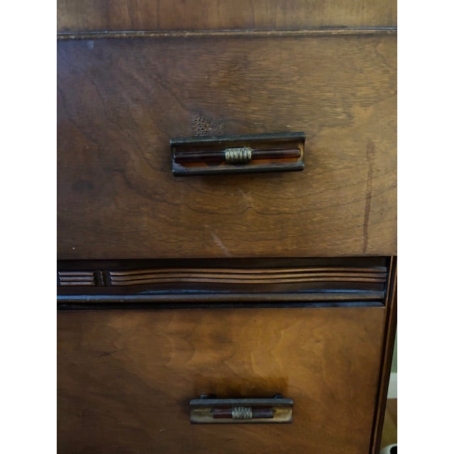 Vintage Waterfall Dresser with Mirror Beautiful vintage waterfall-style dresser featuring a rich wood finish, striking...