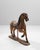 This 1920s French hand-carved wooden carousel horse is a captivating relic of early 20th-century fairground craftsmanship,...