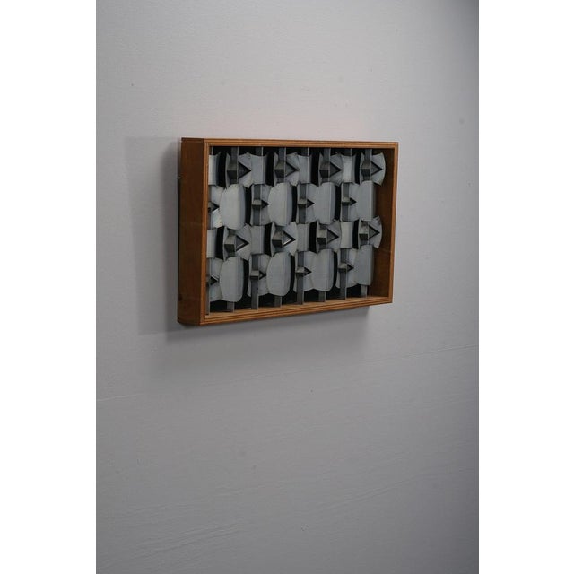 A. Ysermans period: 1974 origin: The Netherlands dimensions: h39 x w65 x d7 cm material: metal, wood I have official proof...