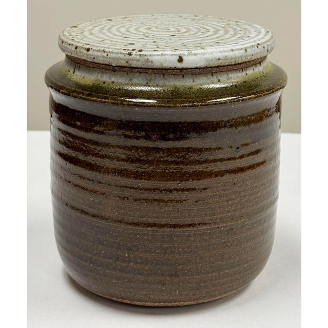 Vintage lidded studio pottery Jar with round speckled gray lid. Handmade and signed on base. No chips or cracks.