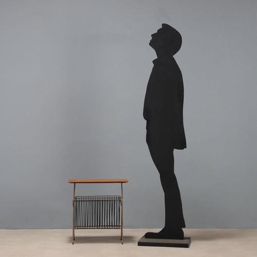 Vintage magazine rack coffee table with rectangular wooden top, brass legs and black lacquered metal magazine racks. This...