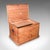 This is an antique carriage chest. An English, pine country house storage trunk, dating to the late Victorian period,...