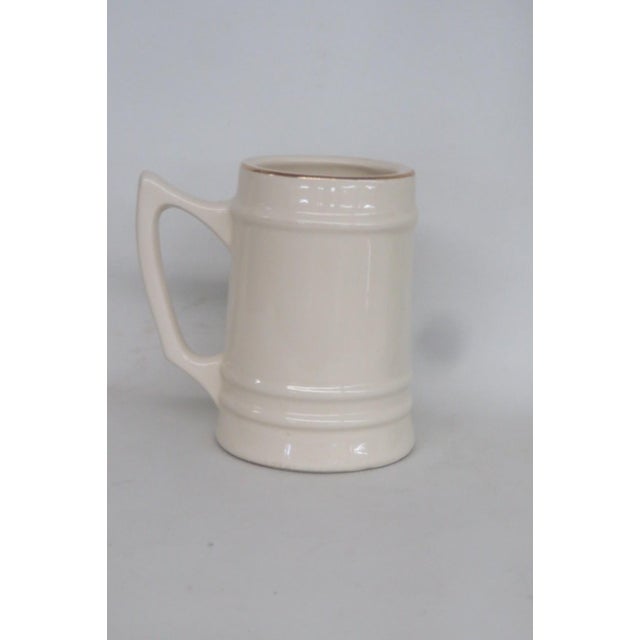 This charming Beer Stein / Coffee Mug is made of ceramic. This collectible large beer stein features the iconic USNA crest...