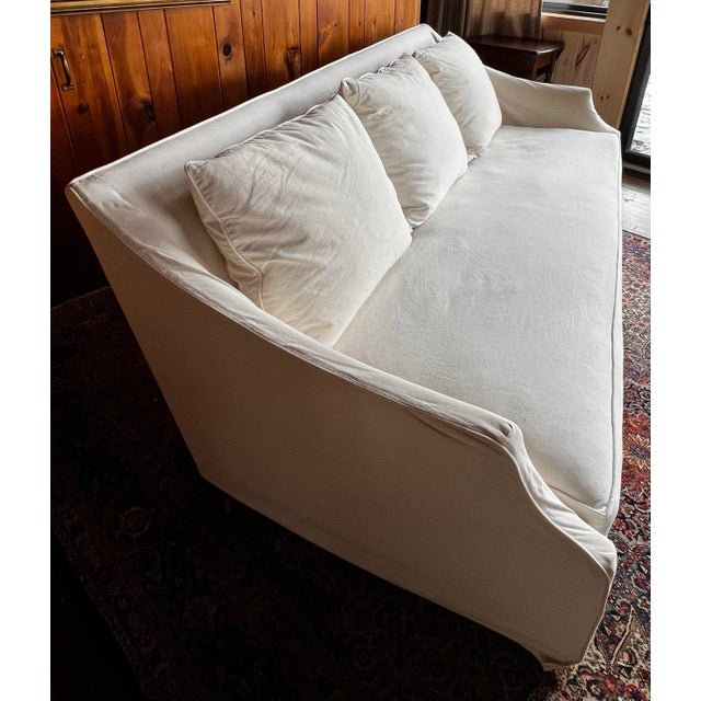 Attributed to Mitchell Gold + Bob Williams “Morgan” slipcovered sofa, deep seat with down feather blend bench cushion and...