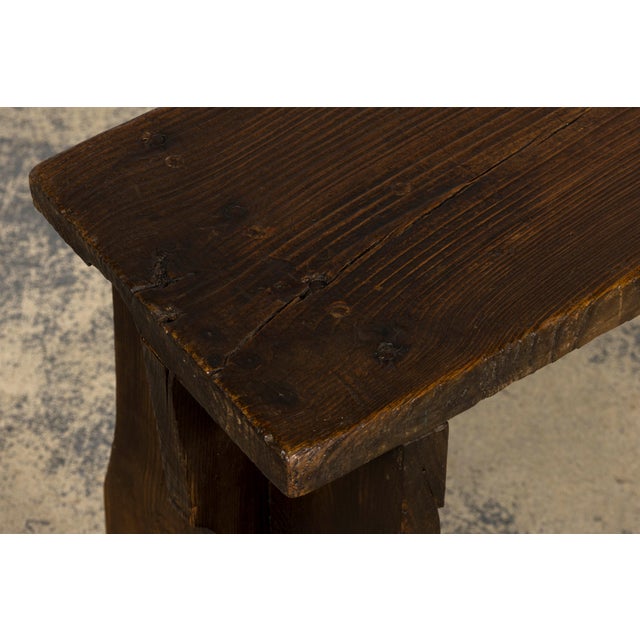 A charming late 19th-century pine farmhouse bench in the French Provincial style, sourced in Provence, France. Handcrafted...
