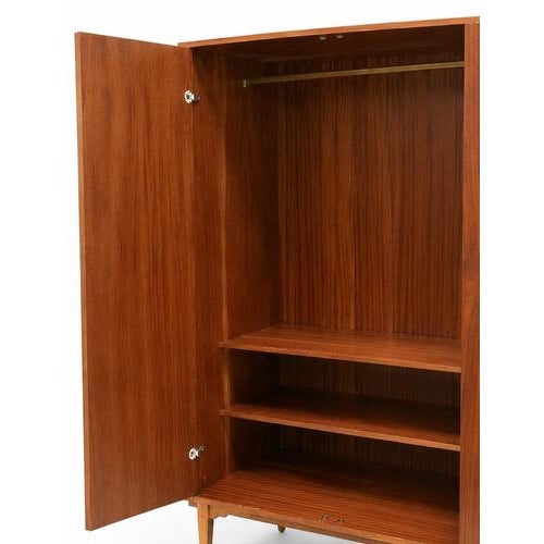 Vintage 4-door wardrobe from the 1960s Bring character and warmth to your interior with this beautiful vintage 4-door...