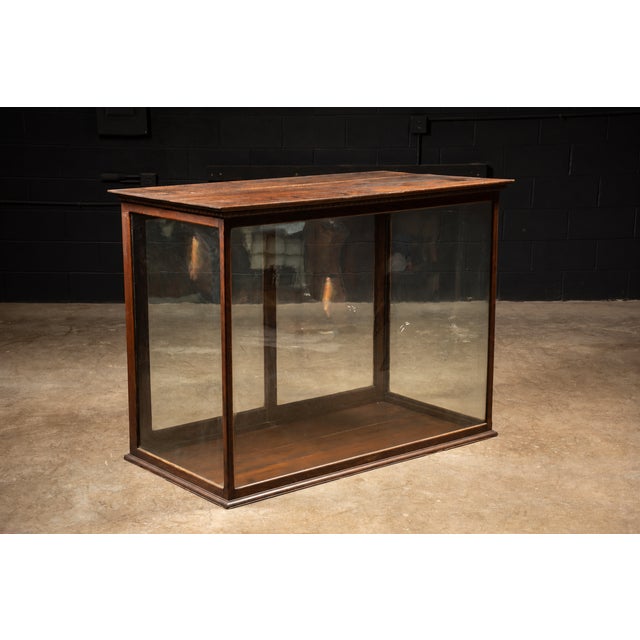Large tank-like glass display case. Interior: 50.5" W x 23.75" D x 40" H