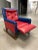 Mid-century modern button tufted red and blue vinyl upholstered child’s reclining rocking club chair, circa 1978.
