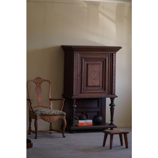 This magnificent baroque-style cabinet, crafted by a Danish cabinet maker in the 1920s, is a stunning example of opulent...