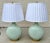 A stunning and elegant pair of large vintage celadon porcelain table lamps, likely dating to the mid-20th century. These...