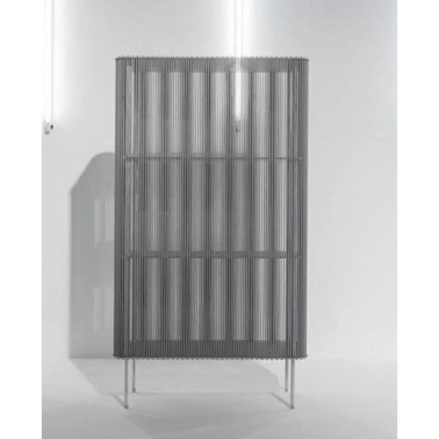 Coil #3 low cabinet by Bram Kerkhofs Dimensions: D80 x W40 x H144.5 cm Materials: Stainless steel, aluminum, elastic rope...