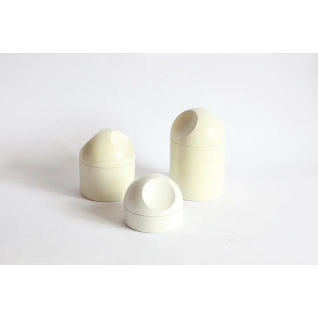 A set of three small storage containers of varying sizes, by Makio Hasuike for Gedy Italy. 9.5, 14 and 18cm in height. All...