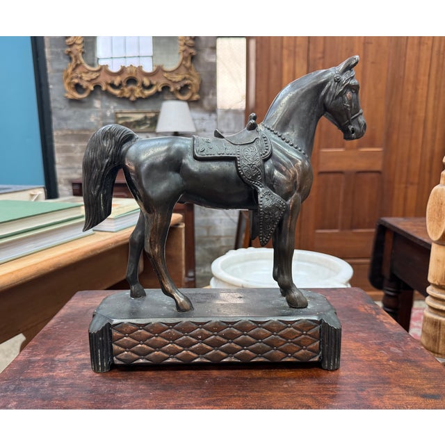 Mid-century horse sculpture, likely originally the base of a mantel clock, crafted in spelter (white metal) with a rich...