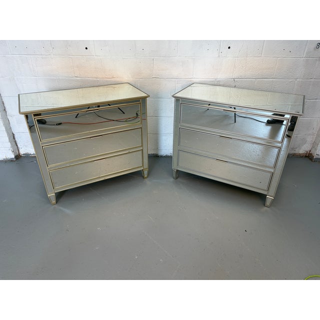 Add a touch of glamour and sophistication to your space with this stunning pair (2) mirrored glass nightstands. Designed...