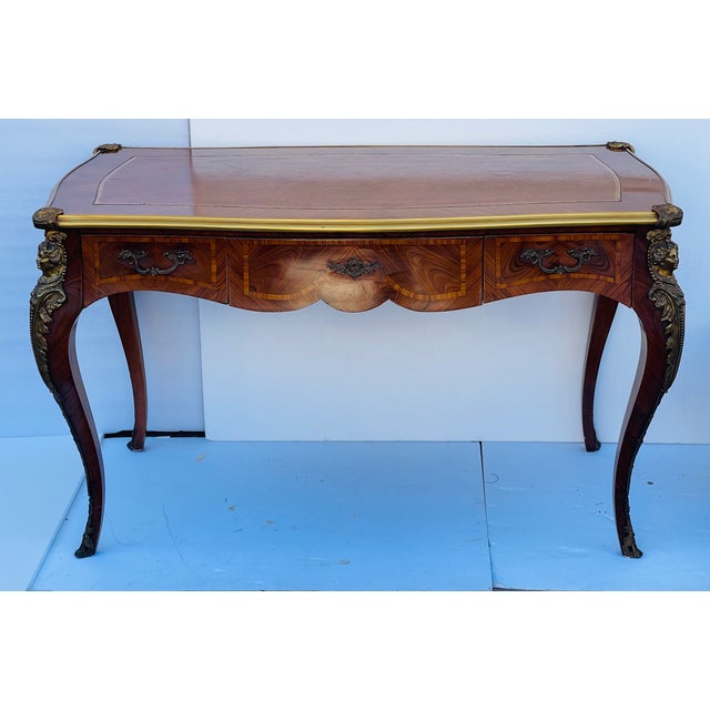 Antique French Louis XVI style writing desk in fruitwood marquetary, with ormolu border and brass carriatides on the...