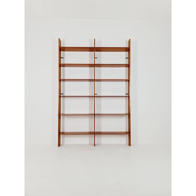 German vintage bookshelf Teak, 1960s Dimensions: Height: 250 cm Width: 167 cm Depth: 25---35 cm It is in vintage...