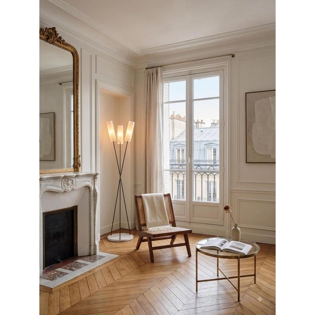 This elegant midcentury floor lamp, attributed to Angelo Lelii, stands out for its unmistakable 1950s Italian modernist...