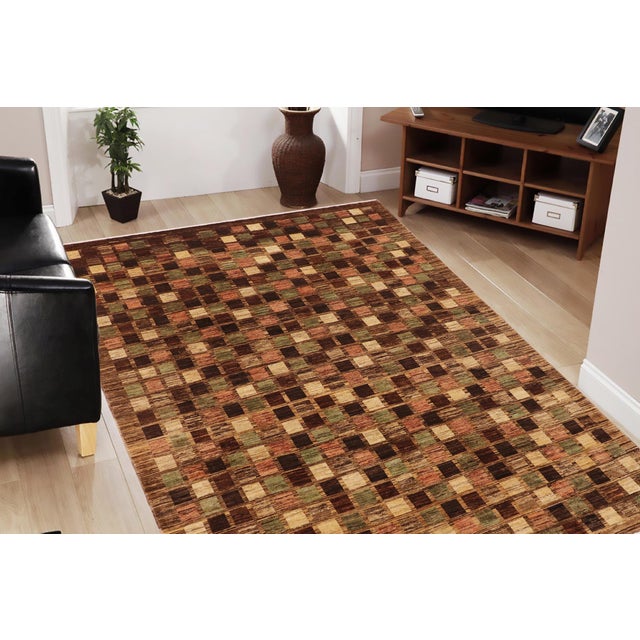Transform your home's interior with a stunning hand-knotted Gabbeh rug. These rugs are meticulously crafted with bold...