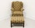 A Chippendale style wing back chair and ottoman by Southwood. Chair has a mahogany wood frame, fabric upholstered in a...